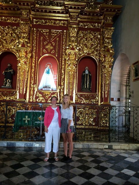 Sheila Gallant-Halloran with daughter Ciara in Bogota, Colombia's Santa Clara Church at the golden altar