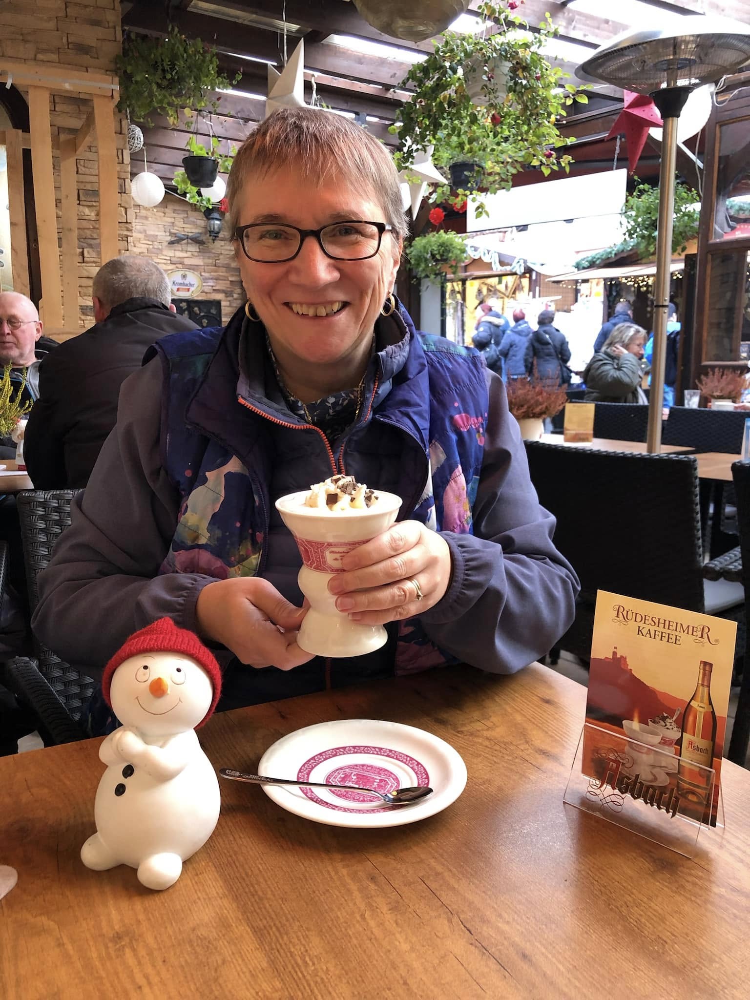 Sheila Gallant-Halloran enjoying a traditional Rüdesheimer Kaffee at a Christmas market in Rüdesheim, Germany, on the Rhine