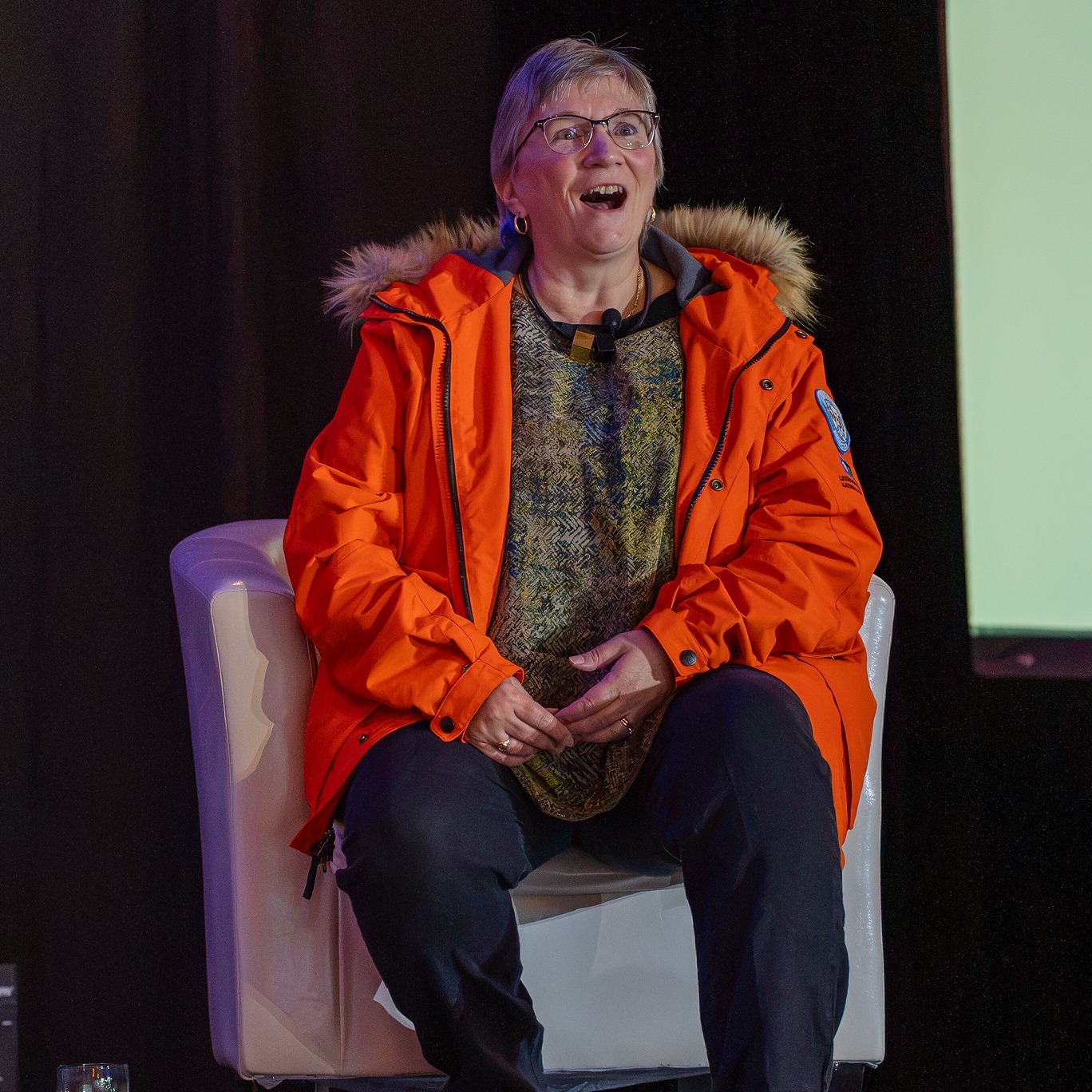 Sheila Gallant-Halloran wearing her National Geographic Antarctica parka on the ACTA Eastern Canada Summit main stage.