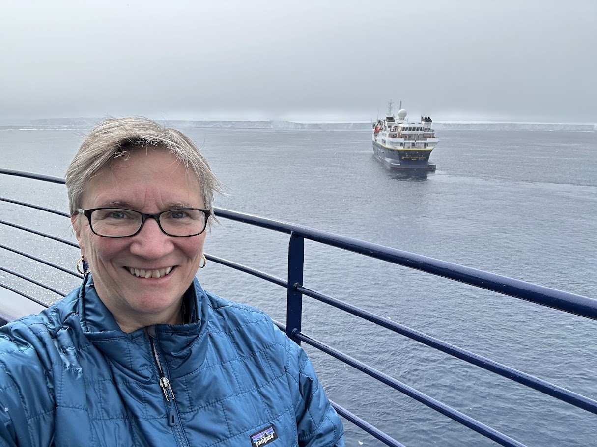 Sheila Gallant-Halloran in Antarctica aboard Lindblad National Geographic Endurance, meeting a Lindblad NG sister ship.